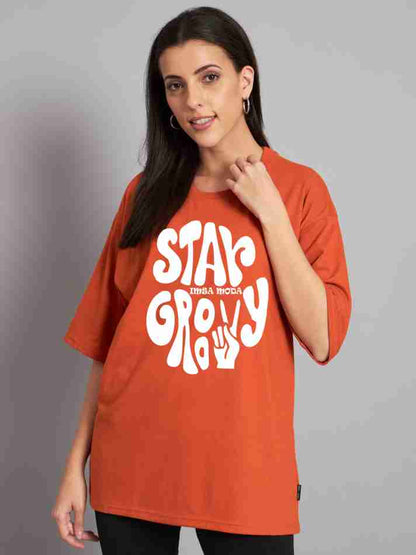 Stay Groovy Typography Printed Drop Shoulder Oversized T-Shirt for Women (Orange) – Trendy Half Sleeve Tee with Classic Round Neck, Soft & Breathable Cotton Blend Fabric for Comfort & Durability. Perfect for a Casual, Comfy, and Stylish Look!